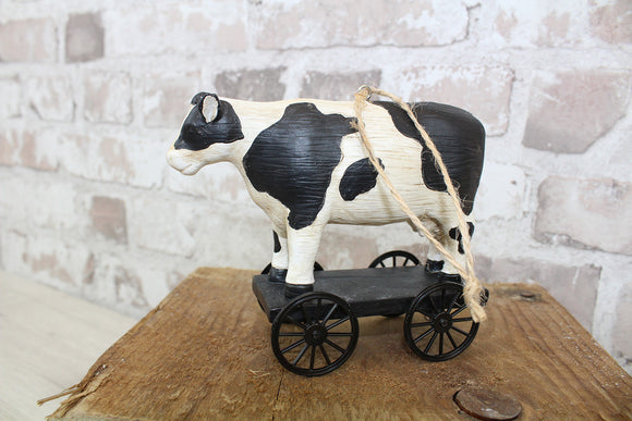 Cow ornament on trolley