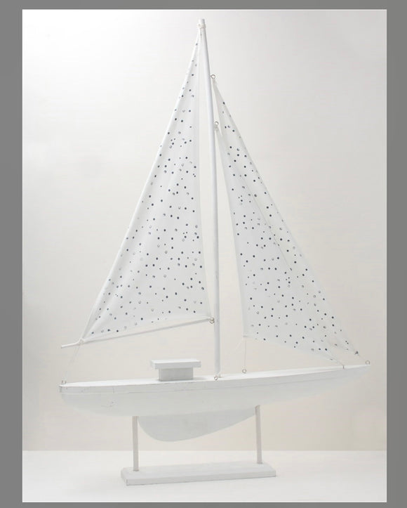 Wooden White Sailboat With Spotty Sail